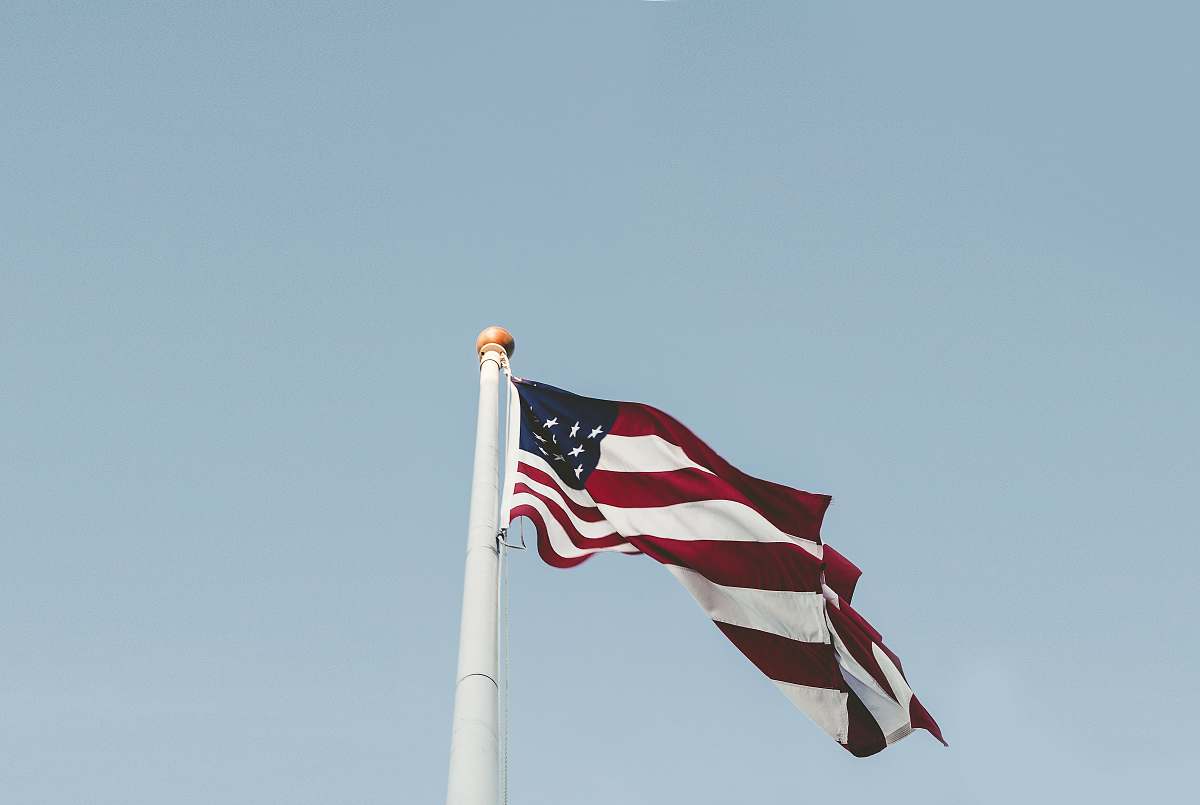 american flag U.S.A flag under blue sky emblem